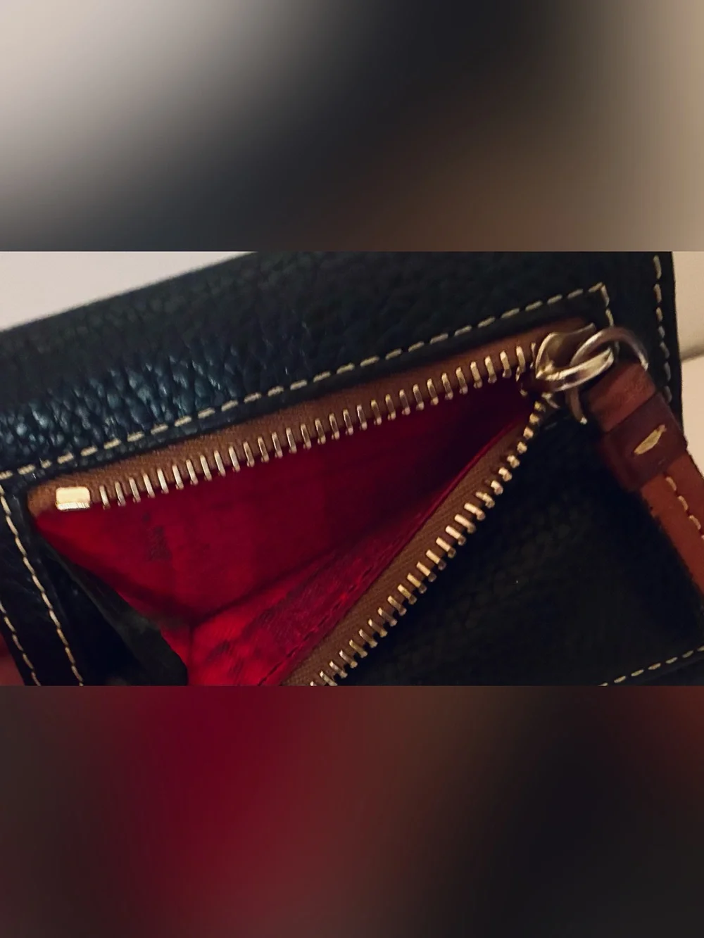 Dooney & Bourke Black Pebbled Leather Wallet with Brown Trim and Gold Plaque